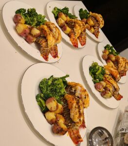 Individual seafood dinners prepared by Chef Phil