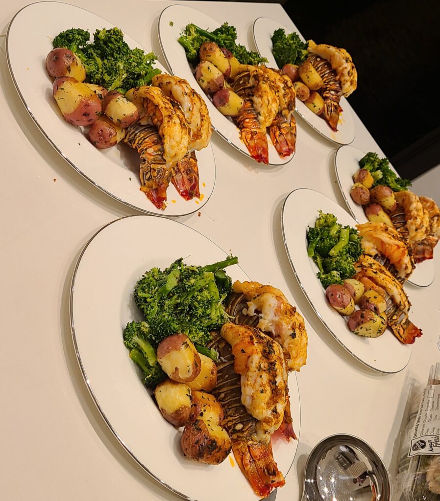 Individual seafood dinners prepared by Chef Phil