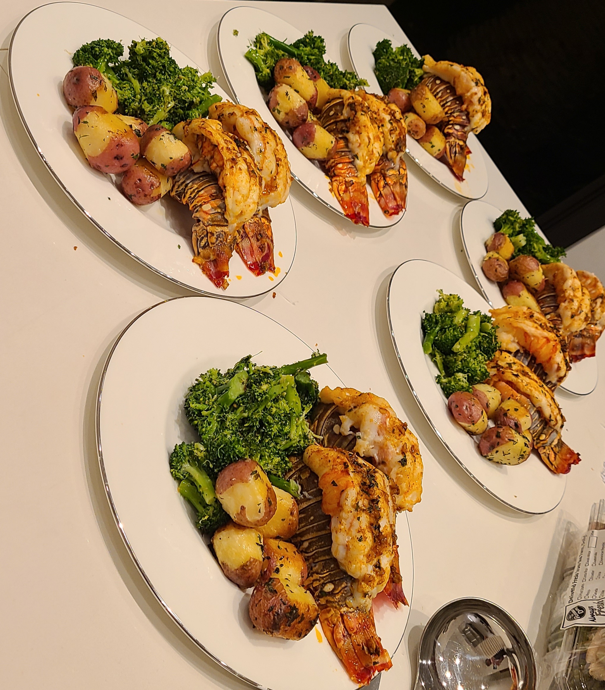 Individual seafood dinners prepared by Chef Phil