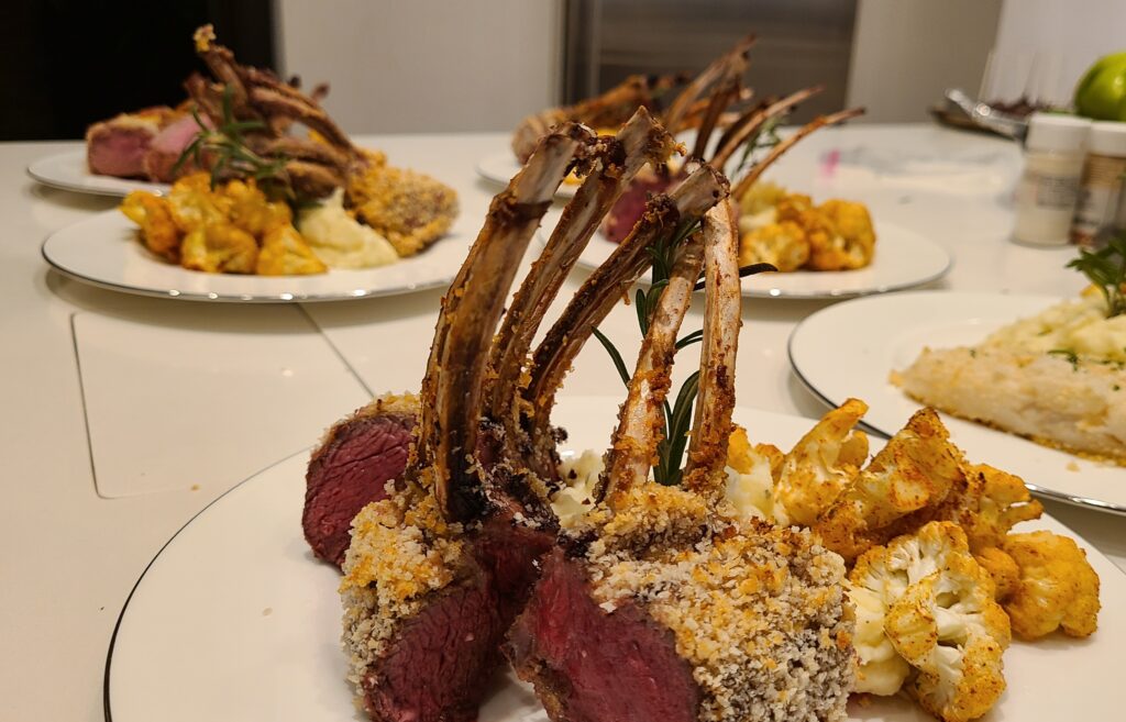 Rack of lamb with side dishes prepared by Chef Phil