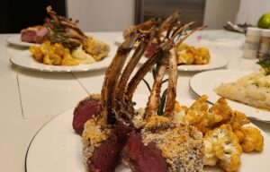 Rack of lamb with side dishes prepared by Chef Phil