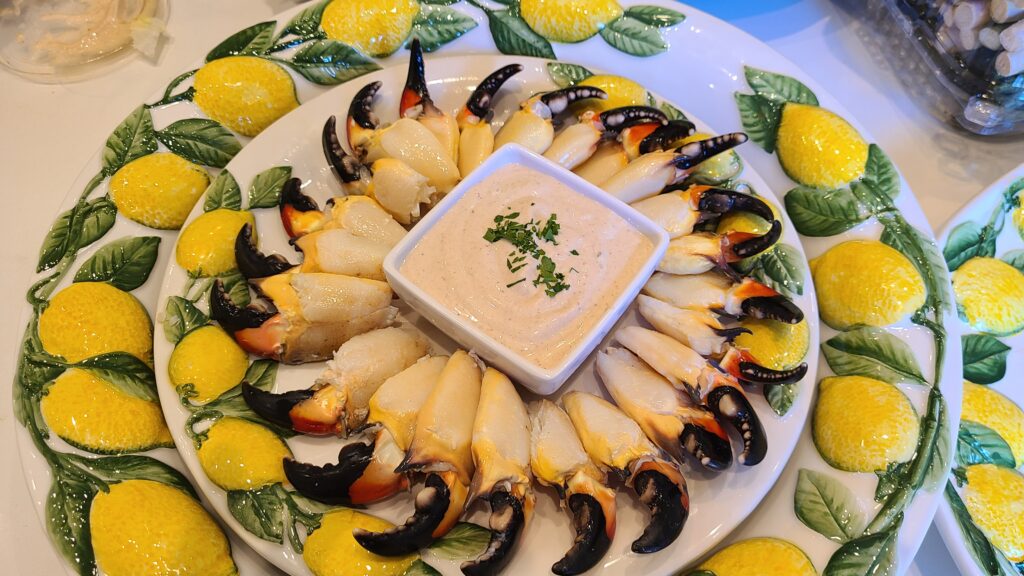 Seafood platter arranged with lemon wedges and greens by Chef Phil